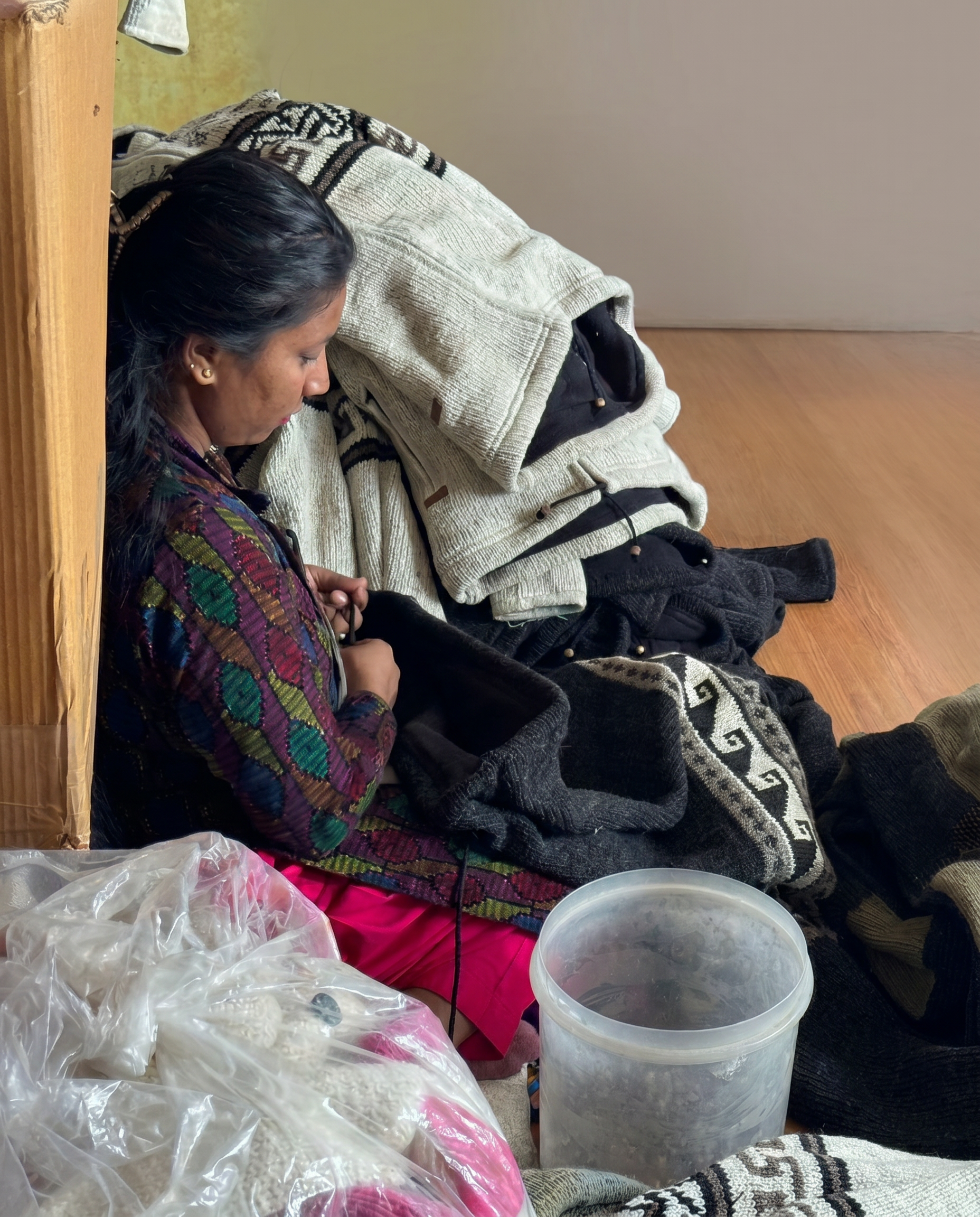 Artisan hand-stitching a woolen hat